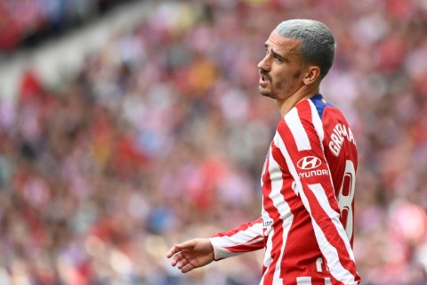 Atletico Madrid's French forward Antoine Griezmann has signed permanently for the club from Barcelona
