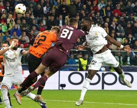Antonio Ruediger (r) scored to earn Real Madrid a 1-1 draw and collided  with Shakhtar Donetsk goalkeeper Anatoliy Trubin (81) and defender Mykola Matviyenko 