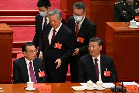 Former president Hu Jintao was unexpectedly led out of the closing ceremony