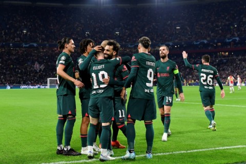Liverpool eased into the Champions League last 16