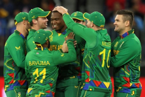 South Africa fast bowler Lungi Ngidi (centre) is congratulated by teammates after taking the wicket of India captain Rohit Sharma