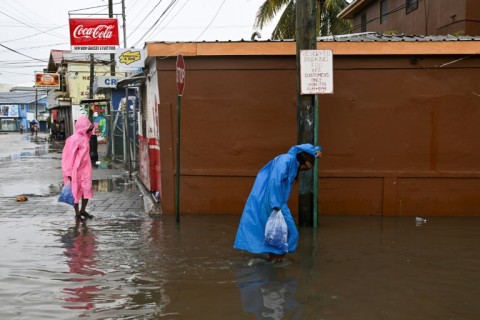 Lisa slammed into the Sibun River just southwest of Belize City, uprooting trees, downing power lines and inundating streets
