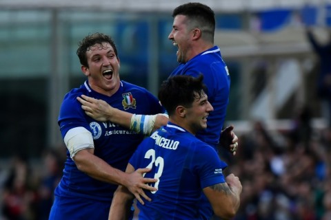 Italy's Michele Lamaro (L), Sebastian Negri (Top R) and Tommaso Menoncello celebrate victory 
