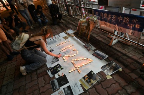 Students light candles on the campus of the Chinese University of Hong Kong, in solidarity with protests held on the mainland over Beijing's Covid-19 restrictions