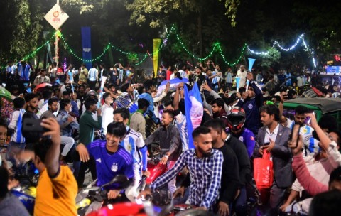 Thousands of Bangladeshi football fans erupt in joy as Argentina topples Poland to advance to the knockout round 