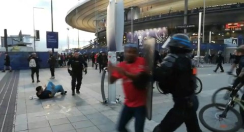 Chaos: This grab taken from an AFP video shows the police intervening as fans climb the fence of the Stade de France before the Champions League final between Liverpool and Real Madrid on May 28
