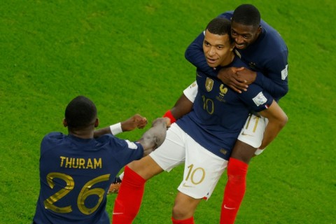 France's Kylian Mbappe (centre) celebrates after scoring the first of his two goals in a 3-1 last 16 win over Poland