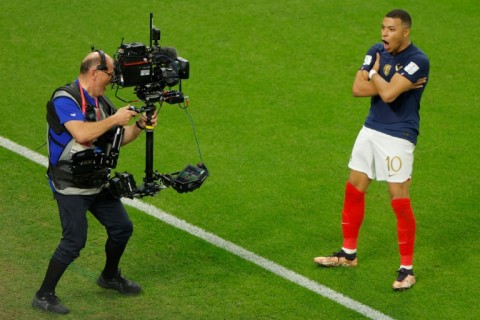 Kylian Mbappe celebrates after scoring in France's win over Poland on Sunday