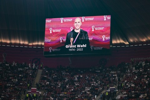A giant screen at the Al Bayt Stadium where England played France at the World Cup shows a tribute to US reporter Grant Wahl who died covering a match the day before