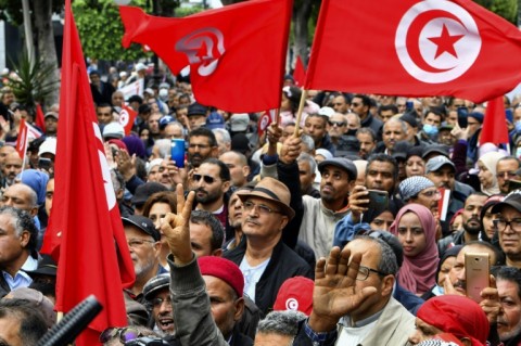 Tunisian demonstrators take part in a rally against President Kais Saied in the capital Tunis