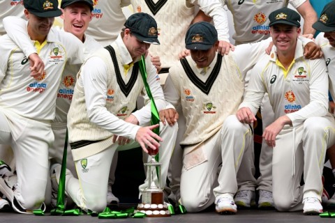 The Australian team pose with the series trophy after winning the second Test between Australia and the West Indies 