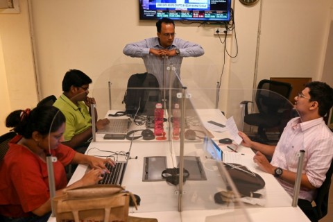 Fact-checkers with the Indian platform Boom Live work in their office in Mumbai in October 2022