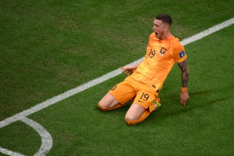 The Netherlands'Wout Weghorst celebrates his dramatic stoppage time equaliser against Argentina