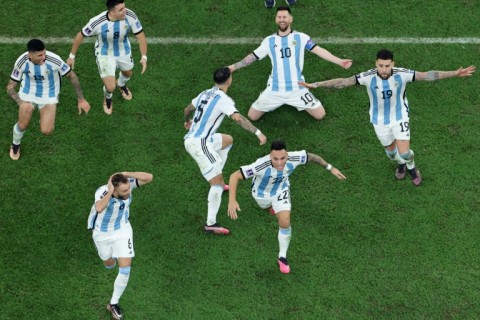 Lionel Messi (2nd R) celebrates after winning the World Cup with Argentina