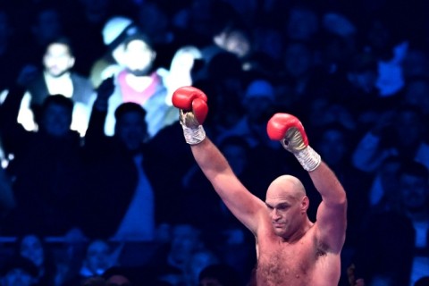 Britain's Tyson Fury celebrates retaining his WBC heavyweight title after a 10th-round stoppage of Derek Chisora
