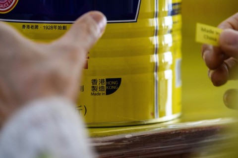 A Hong Kong factory replaces a 'Made in Hong Kong' label in 2020 after the US said goods produced in the city must be marked 'Made in China'