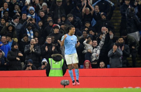 Decisive header - Nathan Ake celebrates scoring Manchester City's third goal in a 3-2 League Cup win over Liverpool at the Etihad Stadium 