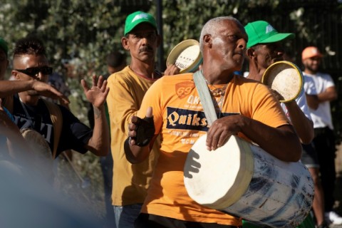 The Minstrels Parade sees troupes dressed in bright coloured costumes parade through Cape Town playing music and dancing