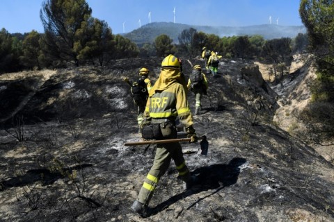 Firefighters put out a wildfire in the Moncayo Natural Park in the northern region of Aragon on August 15 last year.  