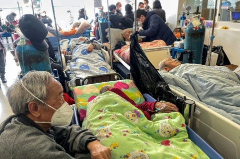 At Tongren Hospital in downtown Shanghai, the corridors overflowed with dozens of elderly patients lying on beds crammed together
