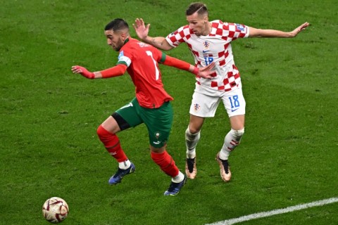 Morocco star Hakim Ziyech (L) playing against Croatia in the World Cup third-place playoff in Qatar on December 17, 2022.
