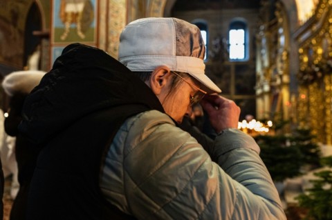 A worshipper prays at the St Michael's Golden-Domed Monastery in Kyiv