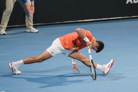 Novak Djokovic stretches in his Adelaide International semi-final 