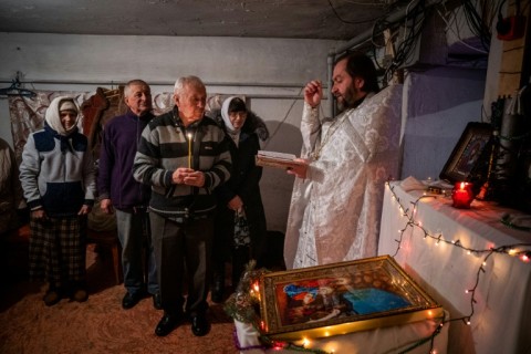 Woeshippers vowed not to let war ruin the holiday as priest Oleg Kruchinin reminded them Christ himself was born in a cave