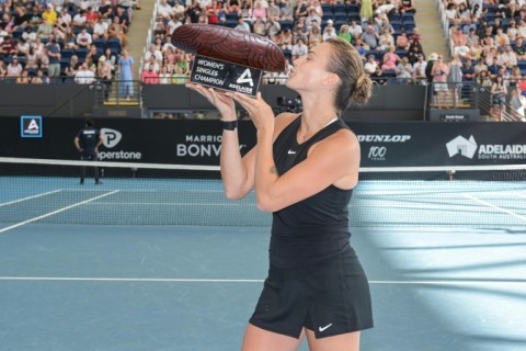 Aryna Sabalenka holds the trophy after winning the Adelaide International 