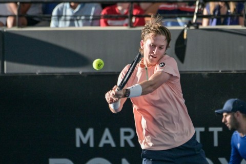 US tennis player tennis player Sebastian Korda hits a return during his final match against Serbian Novak Djokovic at the ATP Adelaide International tournament