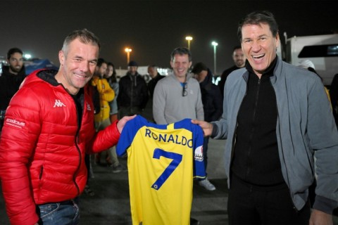 Name game: Former world rally champion Sebastien Loeb (left) is presented with a Cristiano Ronaldo Al-Nassr shirt by the club's French coach Rudi Garcia at the Dakar Rally in Riyadh on Sunday