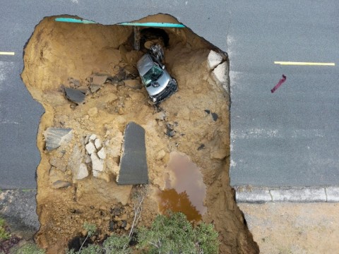 Two cars fell into a sinkhole that opened up in the Los Angeles suburb of Chatsworth