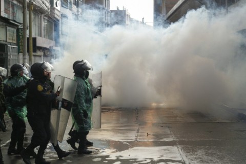 Riot police clash with anti-government protesters in Puno, Peru, on January 9, 2023