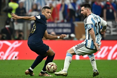 Kylian Mbappe and Lionel Messi come up against each other during last month's World Cup final