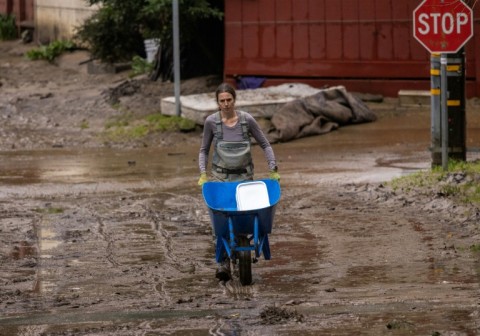 Melissa Foley hands out cleaning equipment to neighors in Felton 