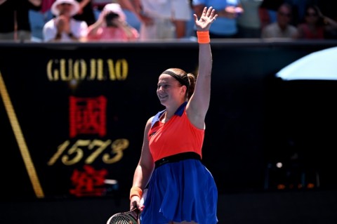 Jelena Ostapenko celebrates victory against Coco Gauff