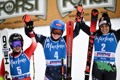 Mikaela Shiffrin (C) won a record-breaking 83rd World Cup race on Tuesday