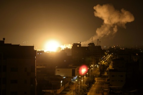 Fire and smoke rise above buildings in Gaza City after  Israel launched air strikes on the Palestinian enclave