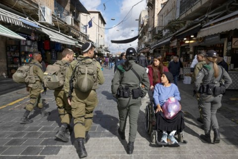 Israeli soldiers patrol the centre of Jerusalem days after a Palestinian gunman killed seven people outside a synagogue in the Israeli-annexed eastern sector of the city