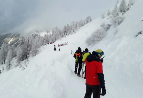 Rescuers during their mission on a slope near Pill, western Austria