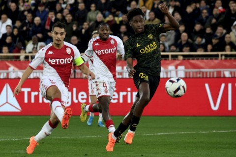 Wissam Ben Yedder (L) scores one of his two goals as Monaco beat Paris Saint-Germain 3-1 in Ligue 1 on Saturday