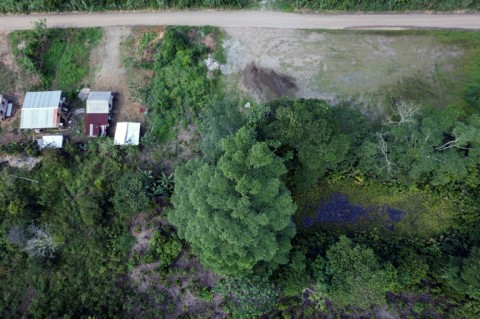 Houses stand near abandoned retention ponds that still contain toxic remnants of the oil production process  
