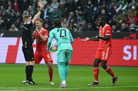 You're off!: Bayern Munich defender Dayot Upamecano is shown a red card 