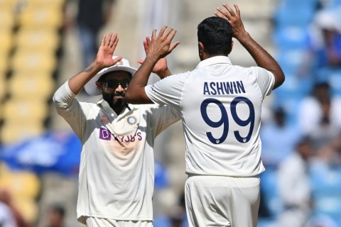 India's Ravichandran Ashwin (right) celebrates an Australian wicket with Ravindra Jadeja