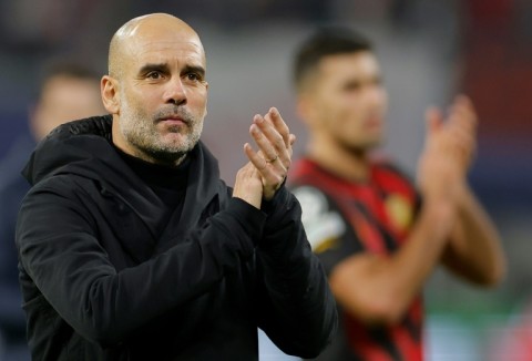 'Nine strikers': Manchester City coach Pep Guardiola applauds the fans in Leipzig