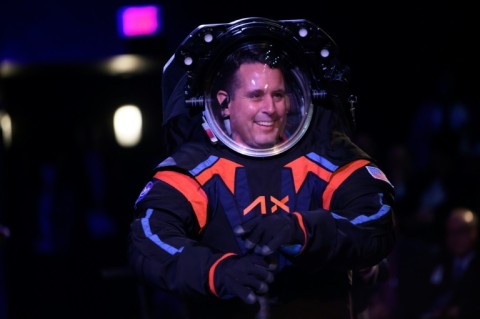 Axiom Space chief engineer Jim Stein models the new spacesuit that will be used on the next mission to the Moon in 2025