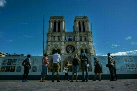 Many of the panels explaining the ongoing reconstruction of Notre-Dame following a devastating fire in 2019 are written in French and English