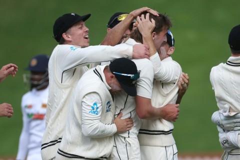 New Zealand players celebrate the wicket of Sri Lanka's Nishan Madushka on their way to winning the second Test on Monday in Wellington