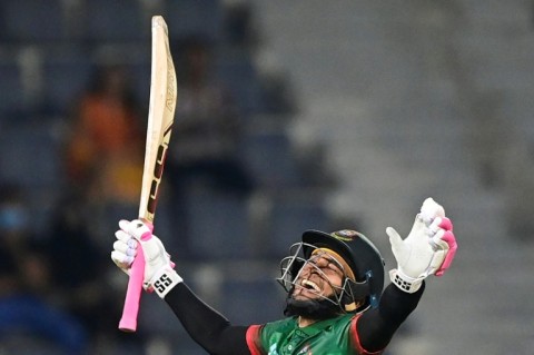 Bangladesh batsman Mushfiqur Rahim  celebrates after scoring a century in the second one-day international against Ireland in Sylhet. The home side made 349-6, their highest ODI score, but the match was called off because of rain