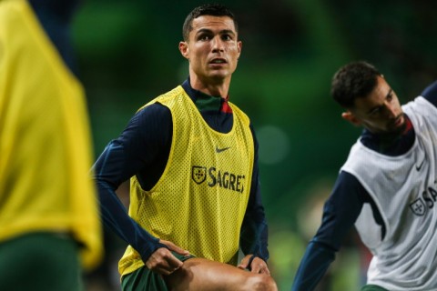 Record-breaker: Cristiano Ronaldo warms up ahead of the match between Portugal and Liechtenstein